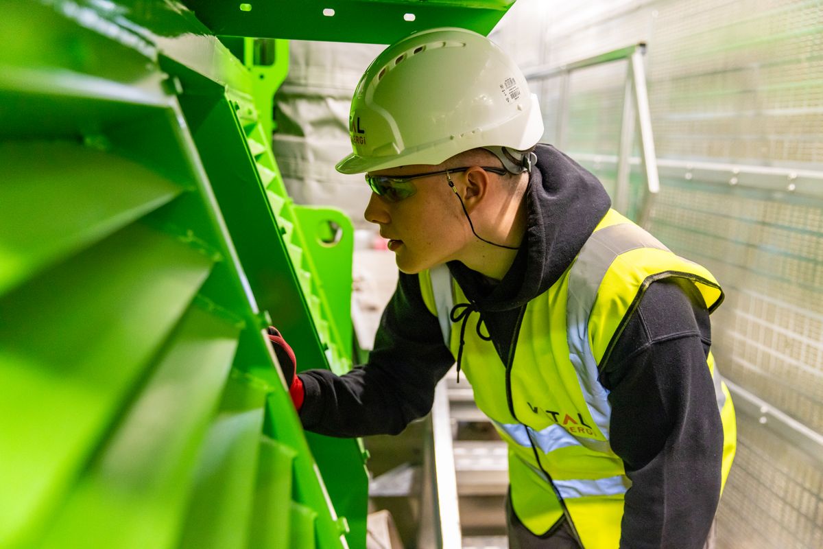 Engineer inspecting a finished component