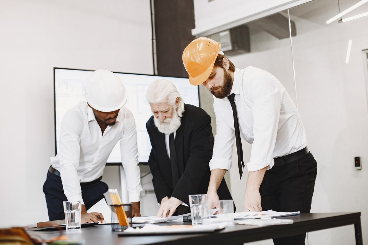 Engineers reviewing tool and die designs